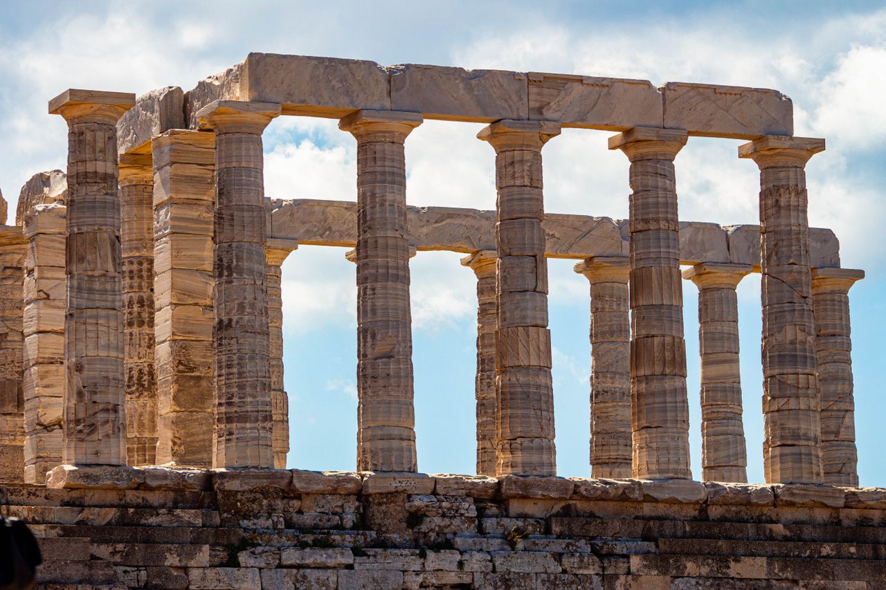 services-05 Stunning view of the iconic Temple of Poseidon at Cape Sounion, Greece.